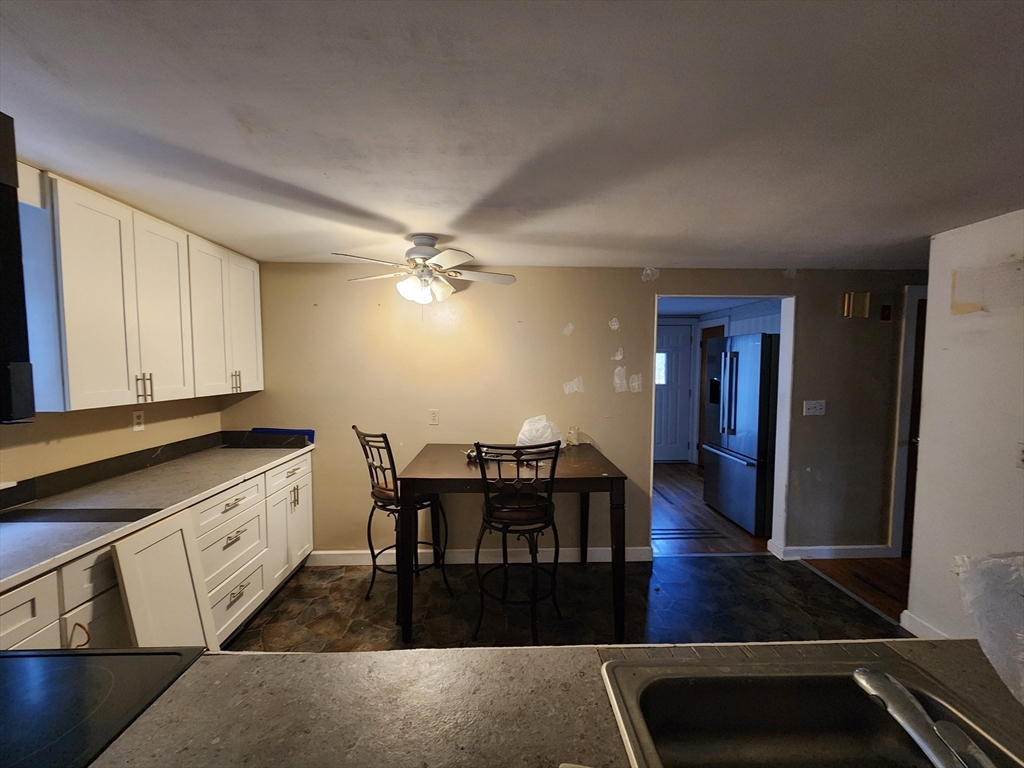 68 Hudson Road Stow, MA 01775 - Photo 4 of 39 a dining room with furniture and wooden floor