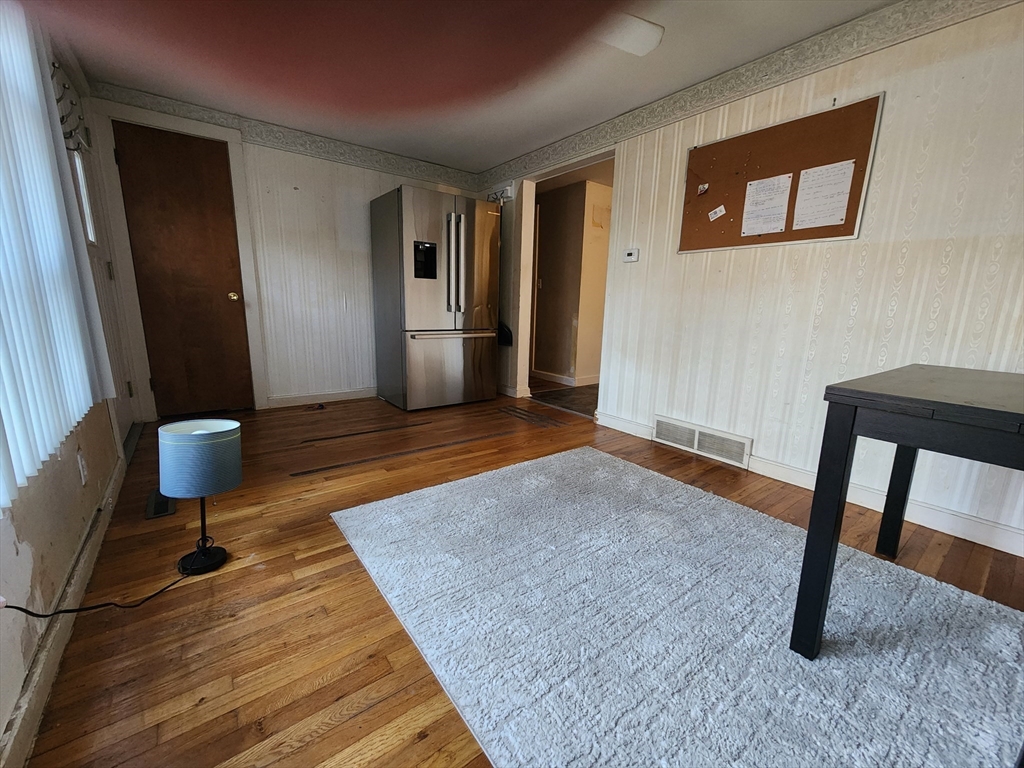 68 Hudson Road Stow, MA 01775 - Photo 9 of 39 a view of a livingroom with furniture and wooden floor