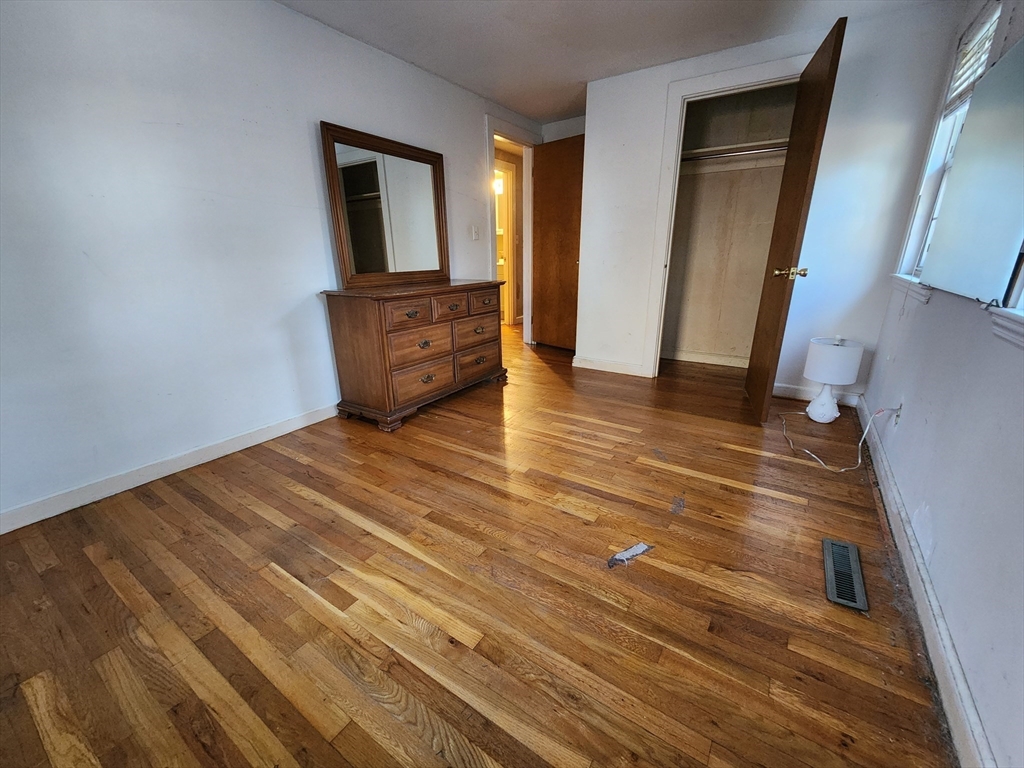 68 Hudson Road Stow, MA 01775 - Photo 10 of 39 a view of empty room with wooden floor