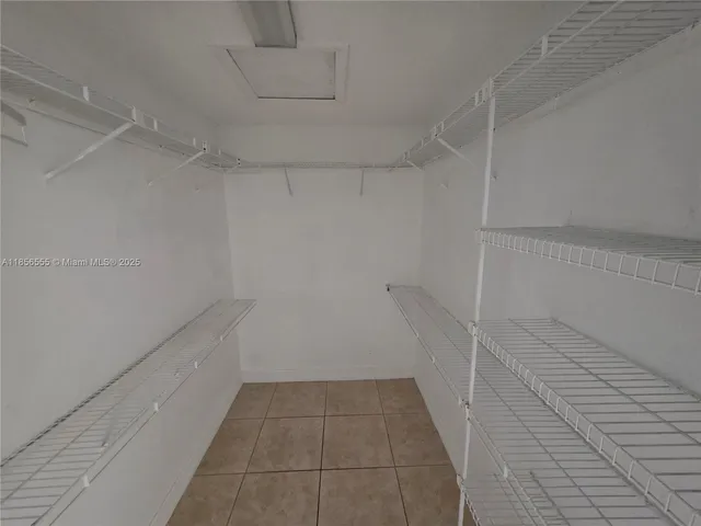 a view of a room with white walls