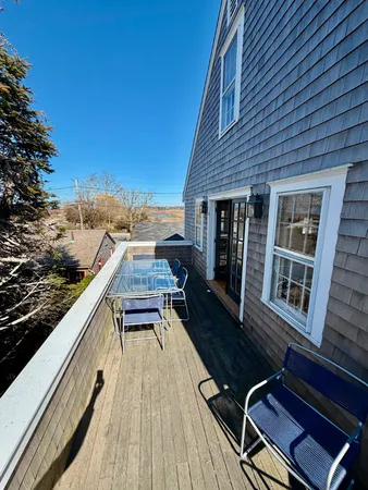 a view of roof deck with patio