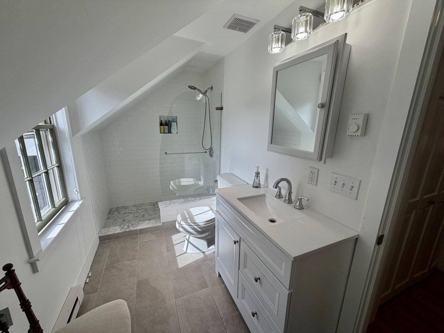 163 Orange Street Nantucket, MA 02554 - Photo 13 of 22 a bathroom with a sink mirror and toilet