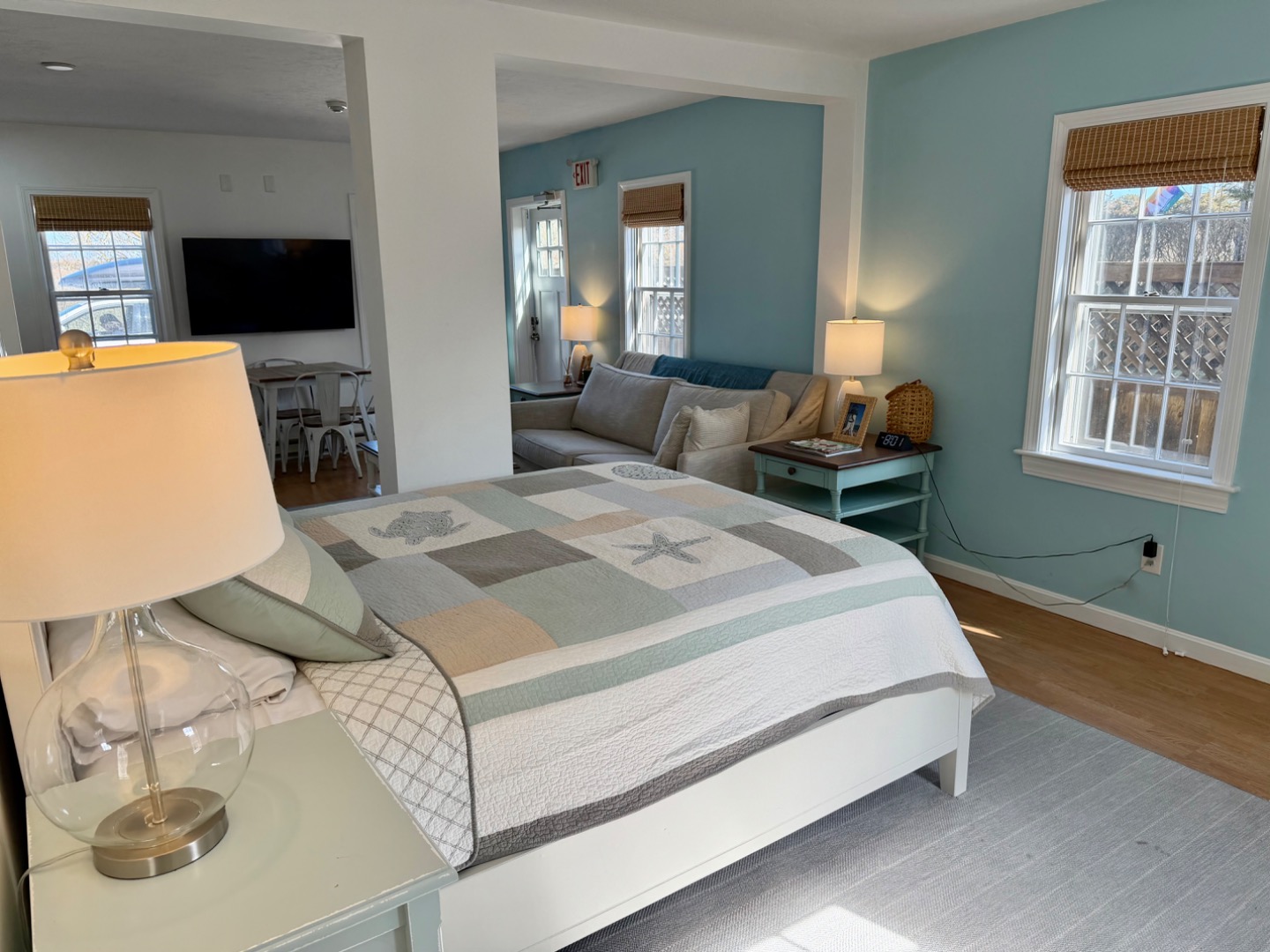 163 Orange Street Nantucket, MA 02554 - Photo 17 of 22 a bedroom with a bed and wooden floor