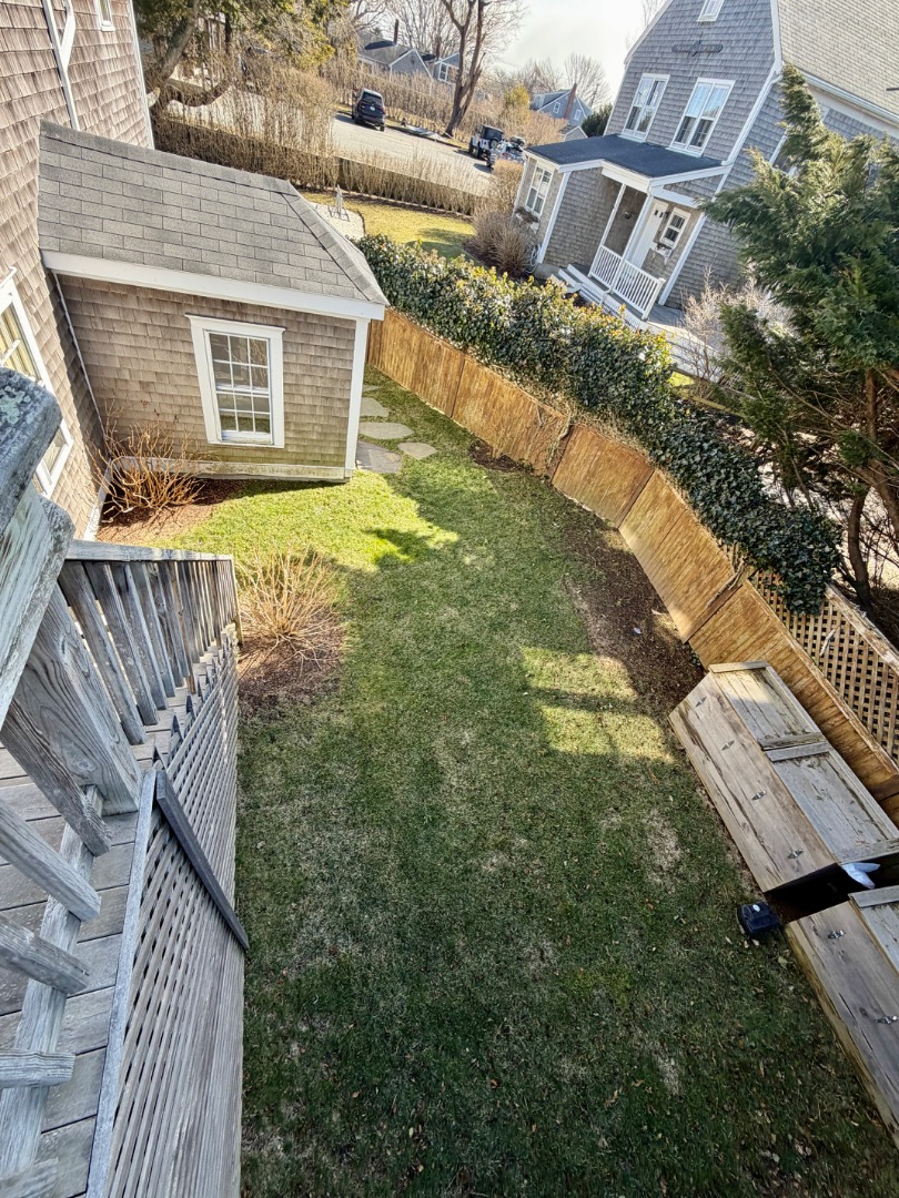 163 Orange Street Nantucket, MA 02554 - Photo 20 of 22 a view of a house with a yard