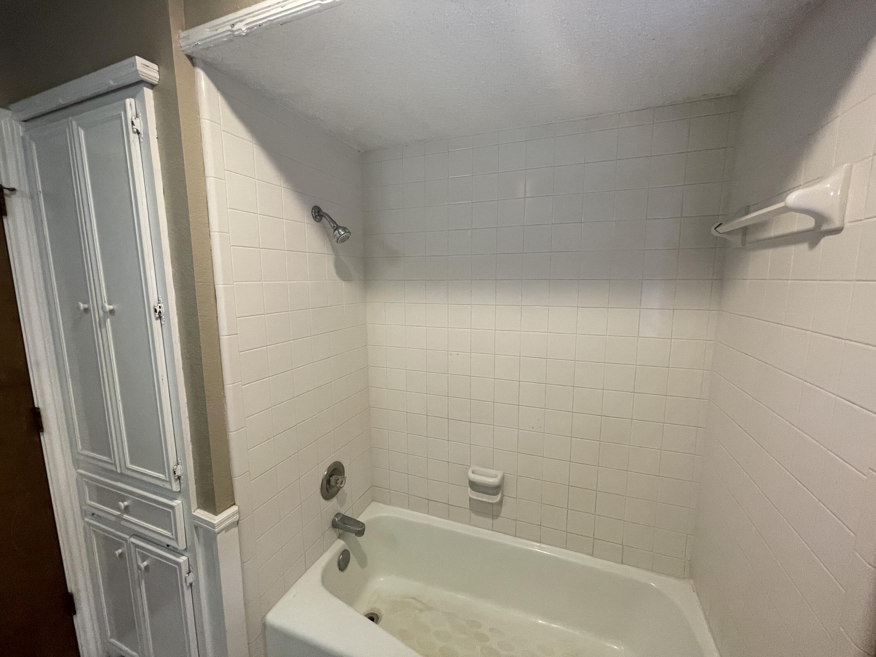 4434 78th Street Lubbock, TX 79424 - Photo 10 of 11 a bathroom with a tub