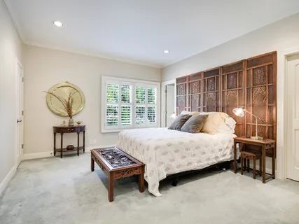 a bed room with a bed and a table