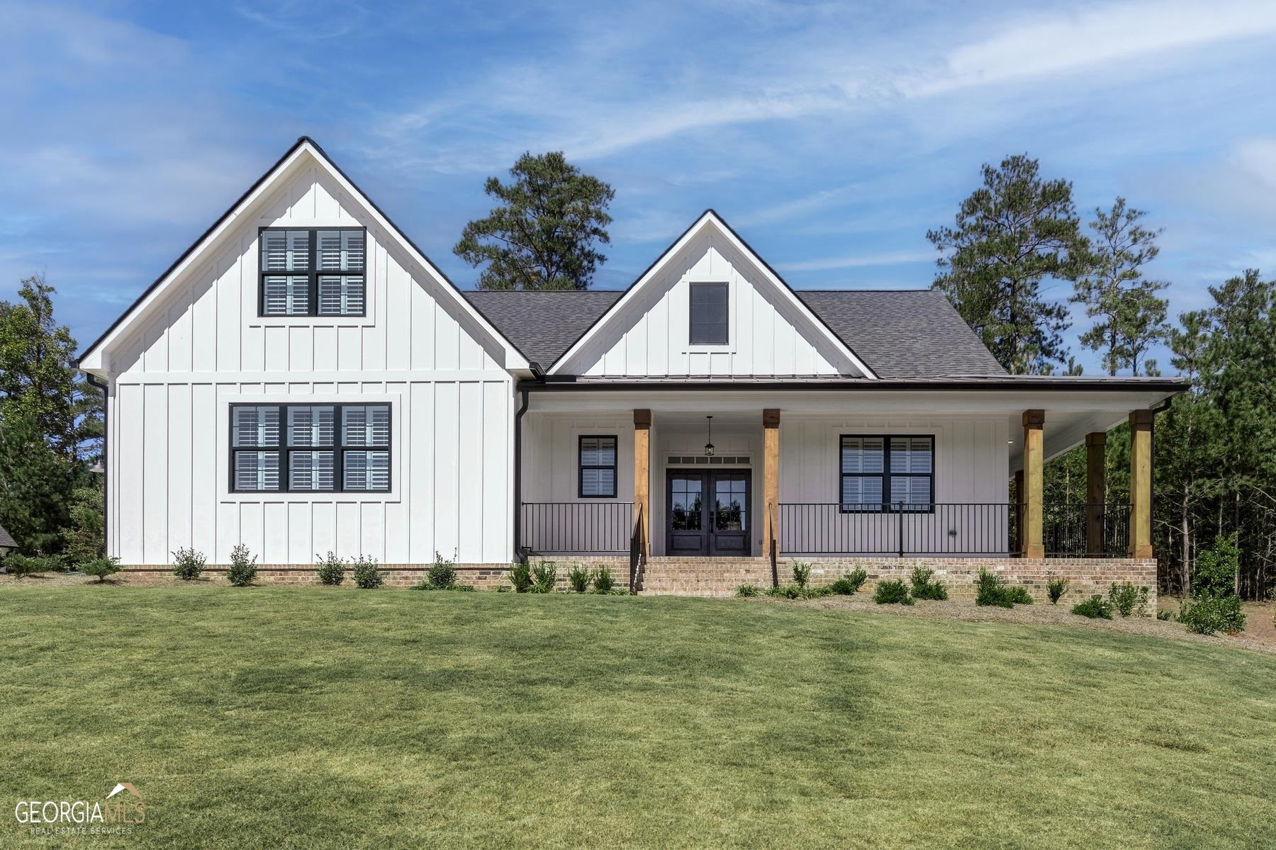 504 London Road Ball Ground, GA 30107 - Photo 1 of 1 a front view of a house with a yard