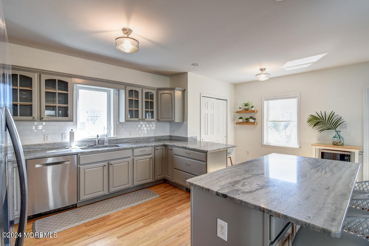 212 Philadelphia Avenue Point Pleasant Beach, NJ 08742 - Photo 14 of 31 a kitchen with lots of counter space and wooden floor