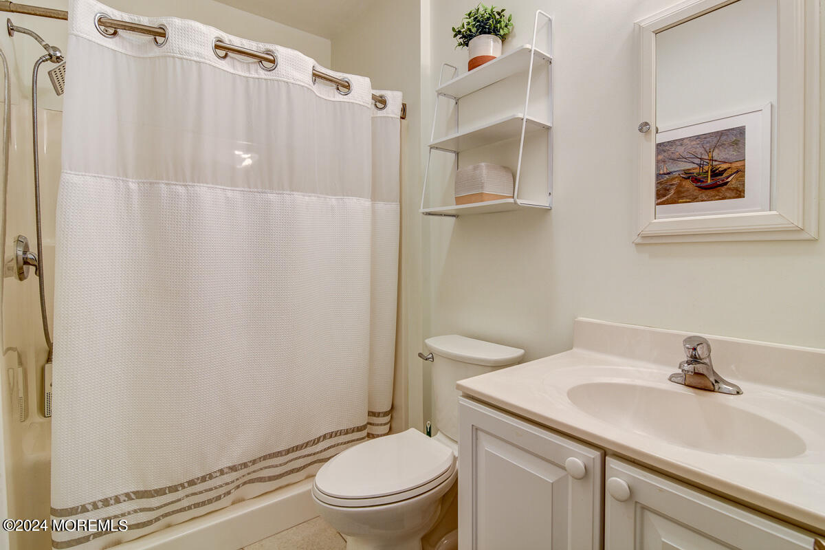 212 Philadelphia Avenue Point Pleasant Beach, NJ 08742 - Photo 16 of 31 a bathroom with a sink toilet and shower