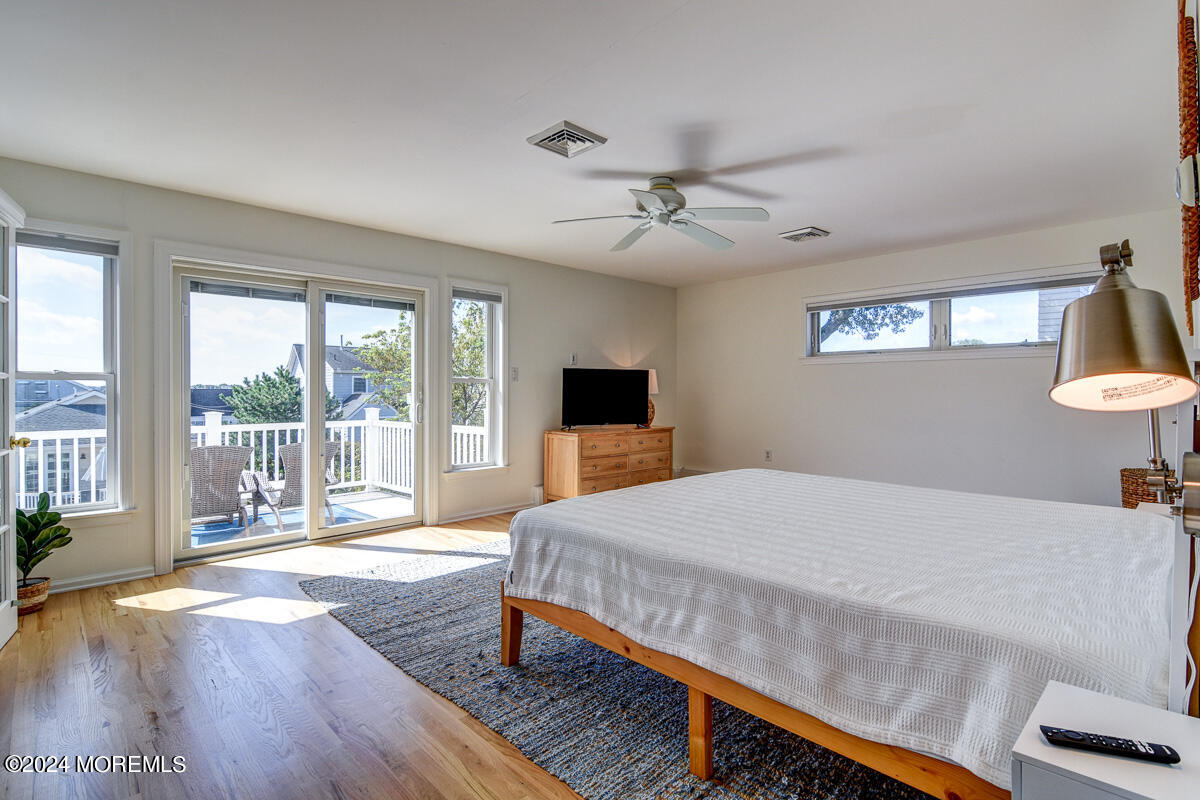 212 Philadelphia Avenue Point Pleasant Beach, NJ 08742 - Photo 18 of 31 a bedroom with a bed and a large window