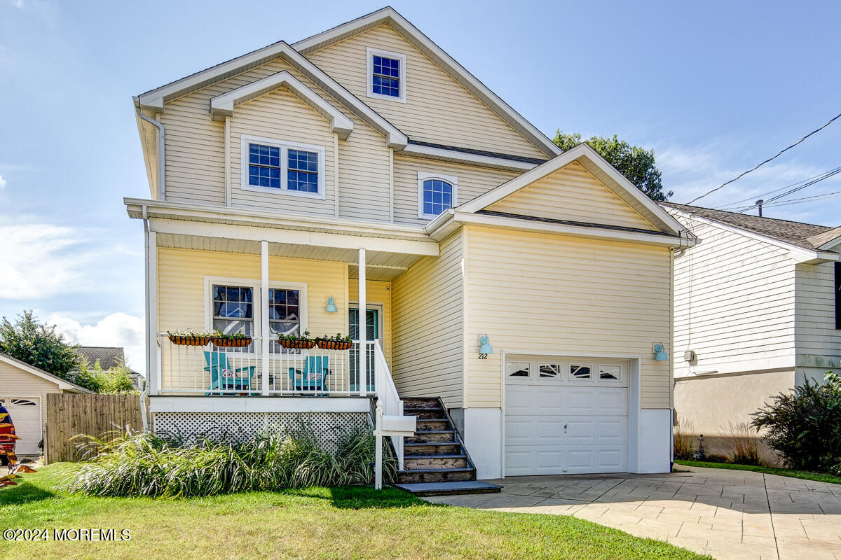 212 Philadelphia Avenue Point Pleasant Beach, NJ 08742 - Photo 2 of 31 a front view of a house with a yard