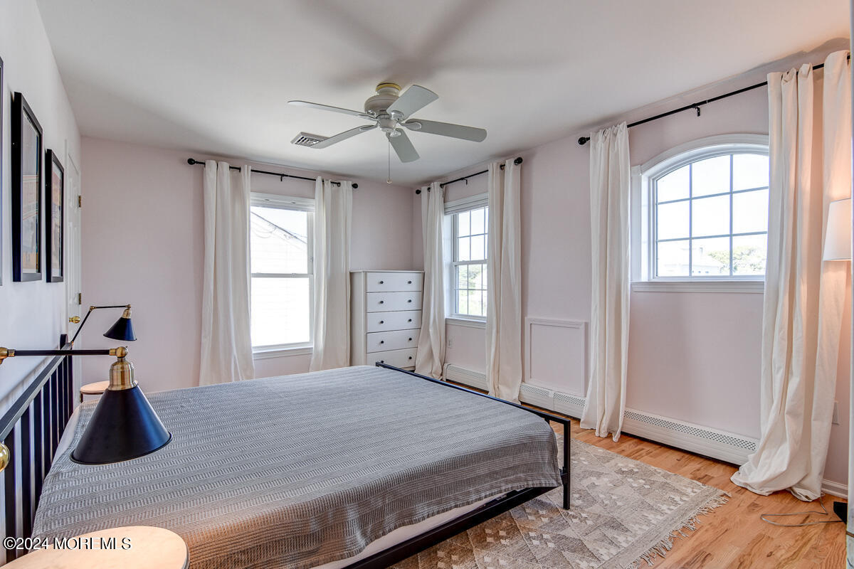 212 Philadelphia Avenue Point Pleasant Beach, NJ 08742 - Photo 26 of 31 a bedroom with a bed and a window