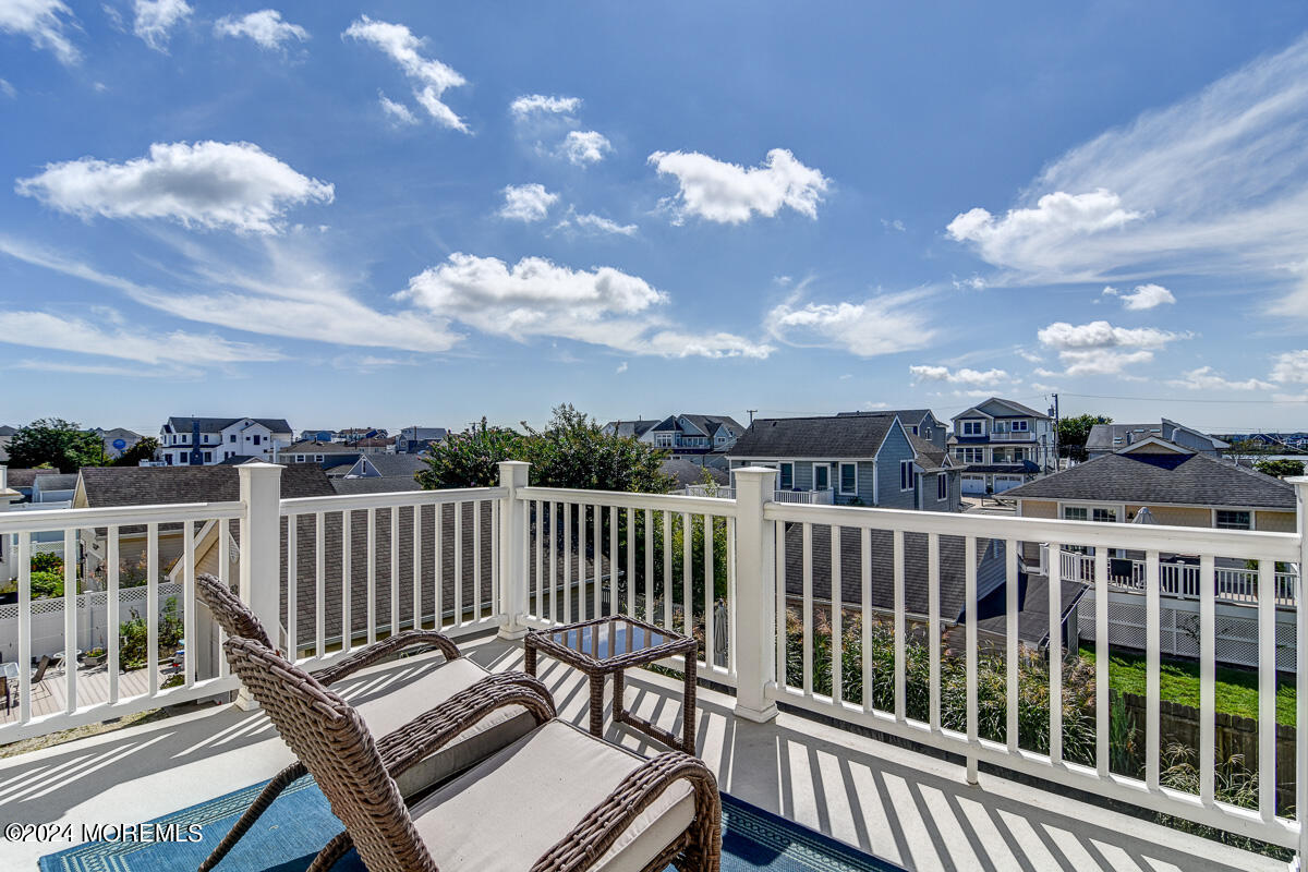 212 Philadelphia Avenue Point Pleasant Beach, NJ 08742 - Photo 30 of 31 a view of a balcony with wooden benches