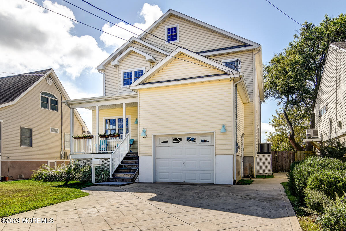212 Philadelphia Avenue Point Pleasant Beach, NJ 08742 - Photo 3 of 31 a front view of a house with a yard