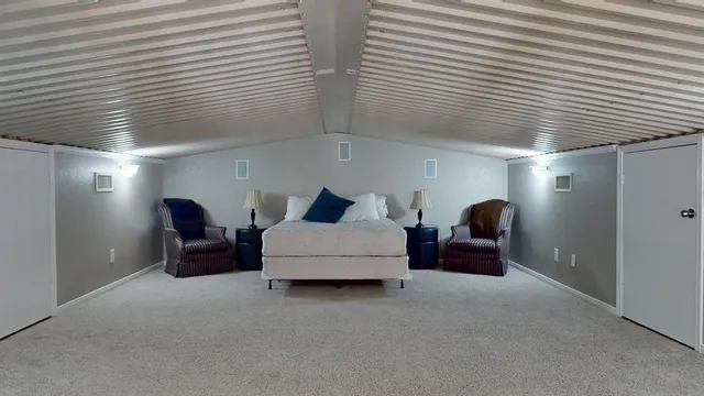 a kitchen with stainless steel appliances granite countertop a sink a stove and refrigerator