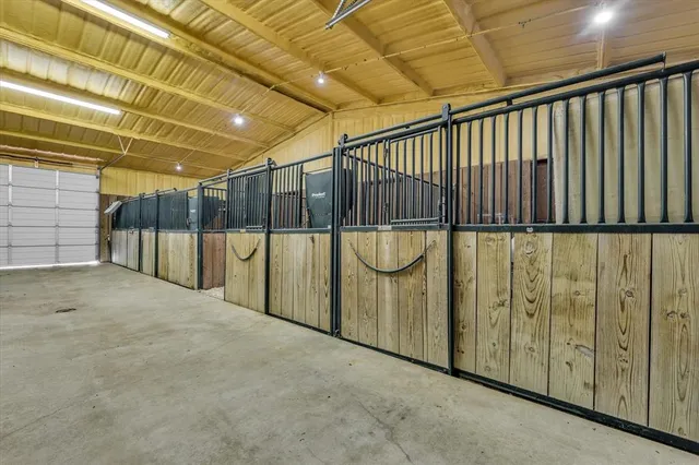 a view of a lake with a yard and outdoor seating