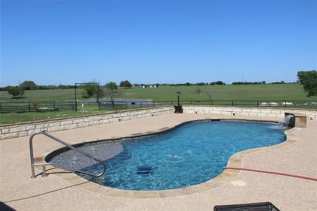 a bed room with bed and a window