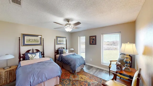 a view of outdoor space with garden and trees