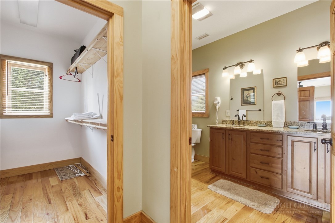 2081 Blackberry Road Boone, NC 28607 - Photo 31 of 45 a bathroom with a sink a mirror and a shower