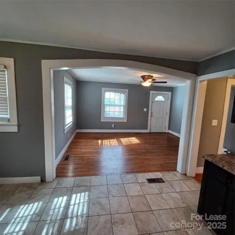 a view of livingroom with hardwood floor and hallway