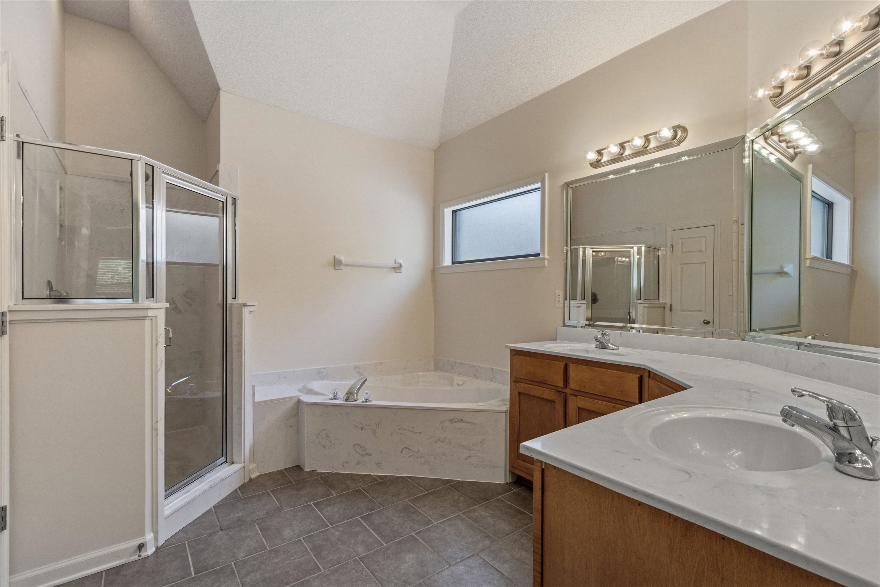 3671 Haynes Road Bartlett, TN 38133 - Photo 24 of 40 a bathroom with a sink double vanity granite tub and shower