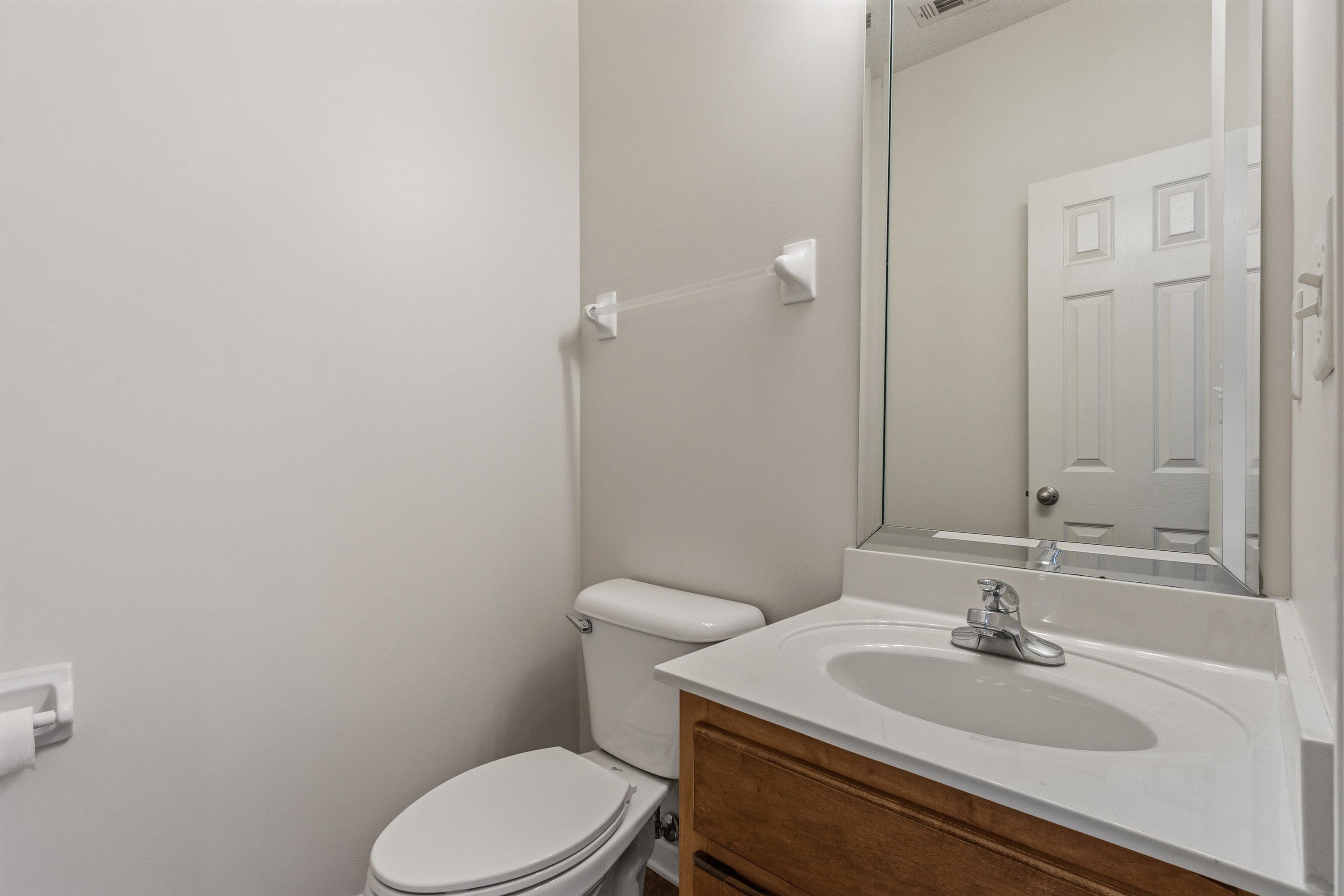 3671 Haynes Road Bartlett, TN 38133 - Photo 27 of 40 a bathroom with a sink a toilet and a mirror