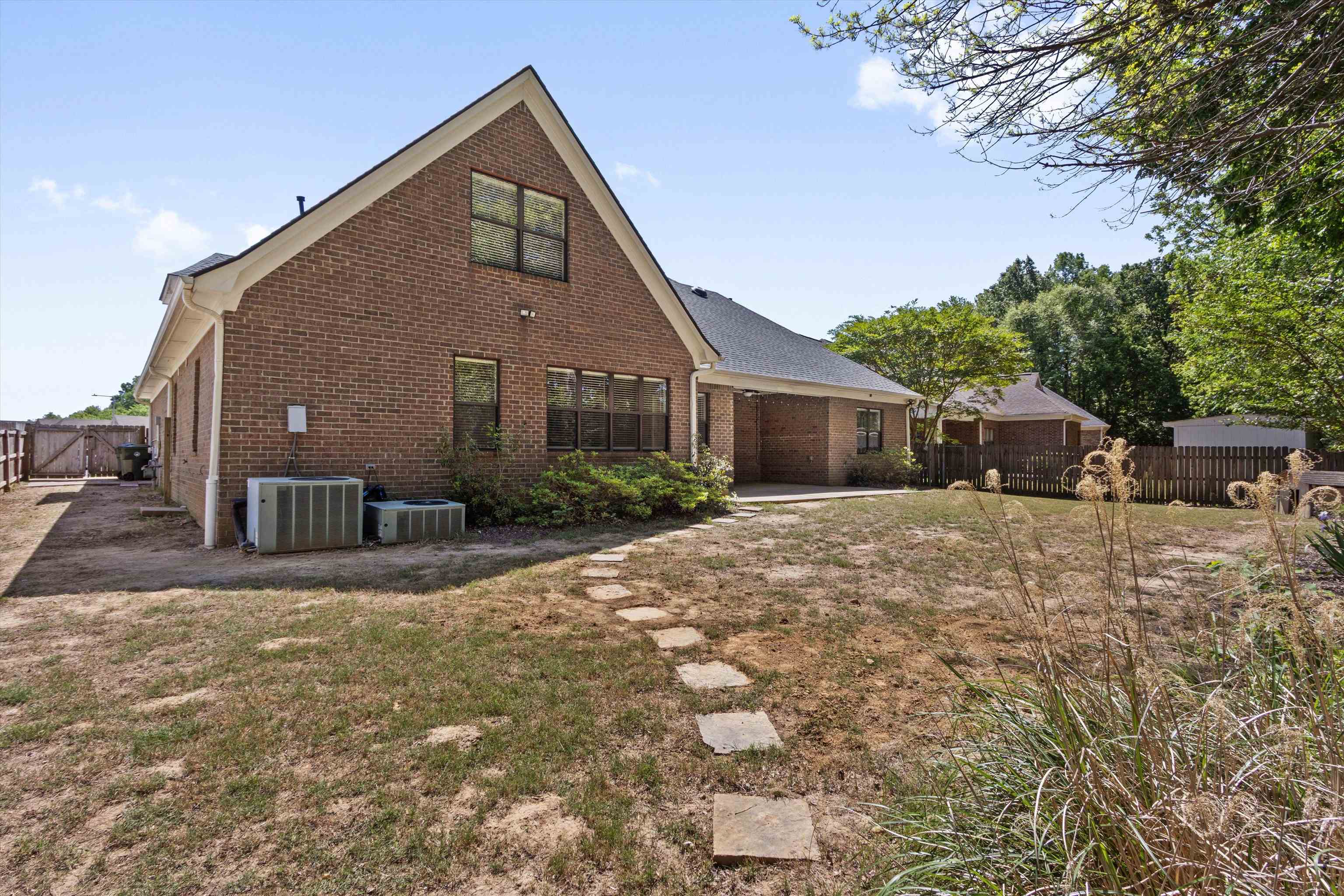 3671 Haynes Road Bartlett, TN 38133 - Photo 36 of 40 a front view of a house with a yard and garage