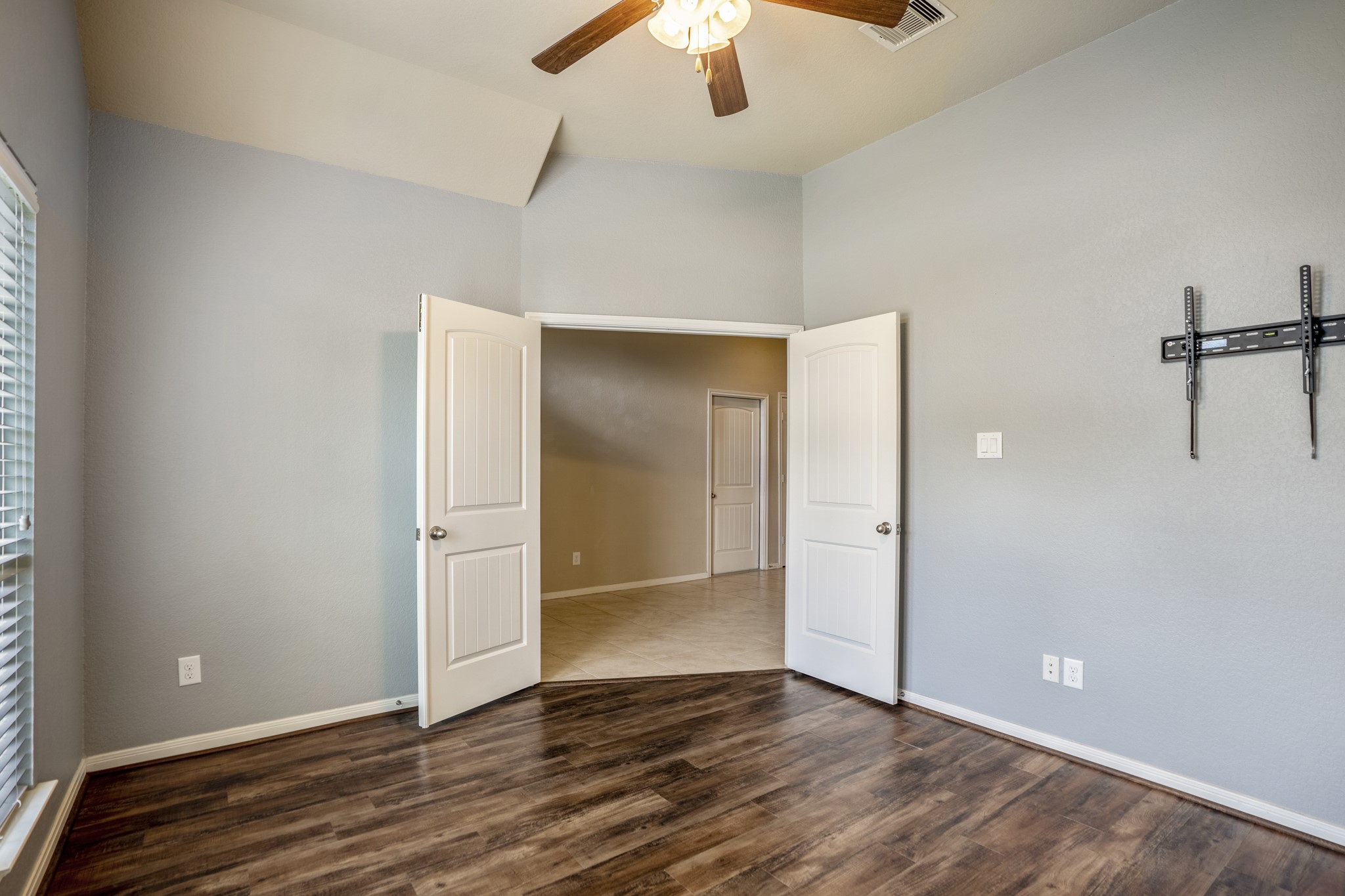 5319 Claymore Meadow Lane Spring, TX 77389 - Photo 7 of 34 an empty room with wooden floor and a ceiling fan