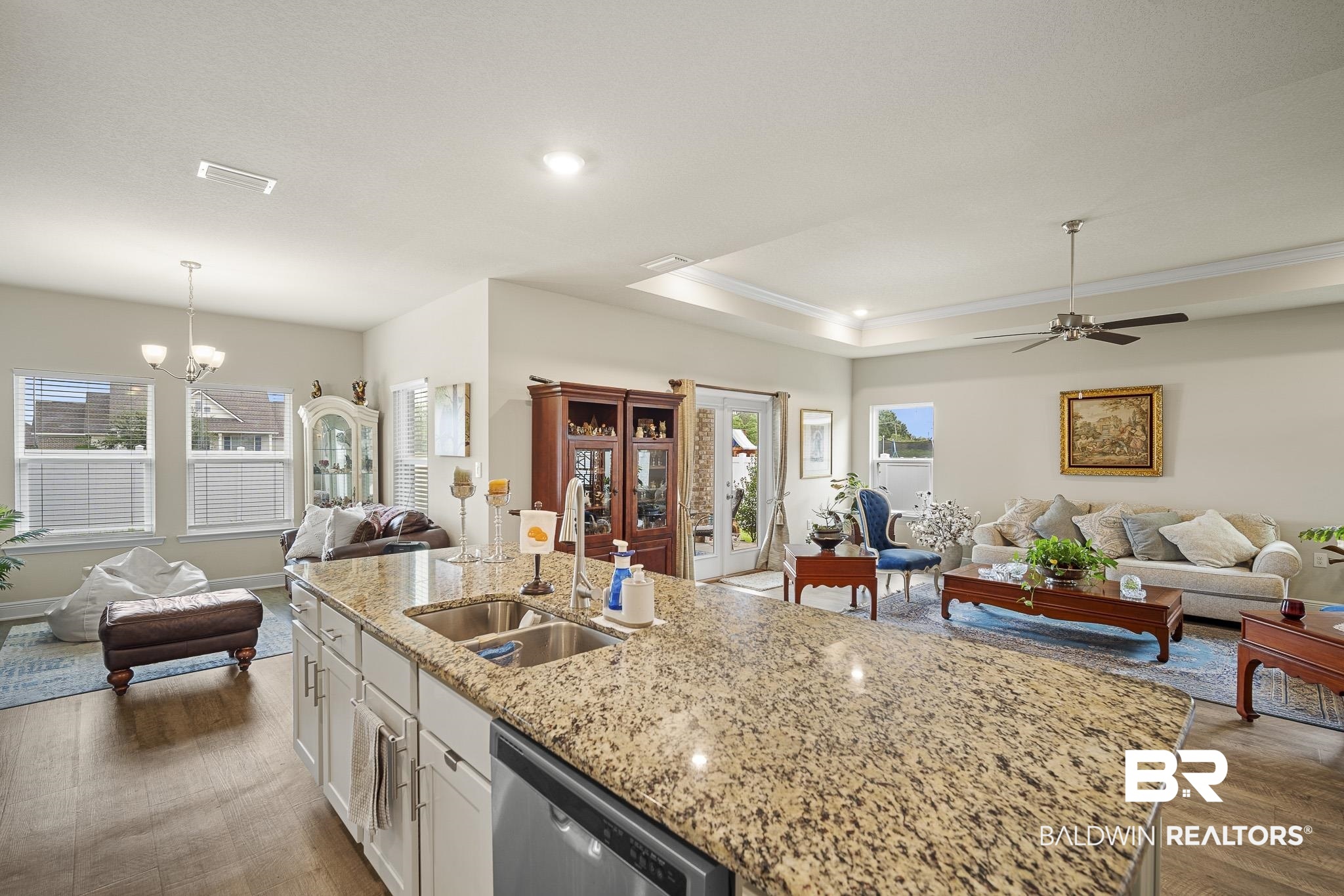 24765 Spectacular Bid Loop Daphne, AL 36526 - Photo 21 of 45 Kitchen featuring pendant lighting, white cabinetry, dishwasher, sink, and an island with sink