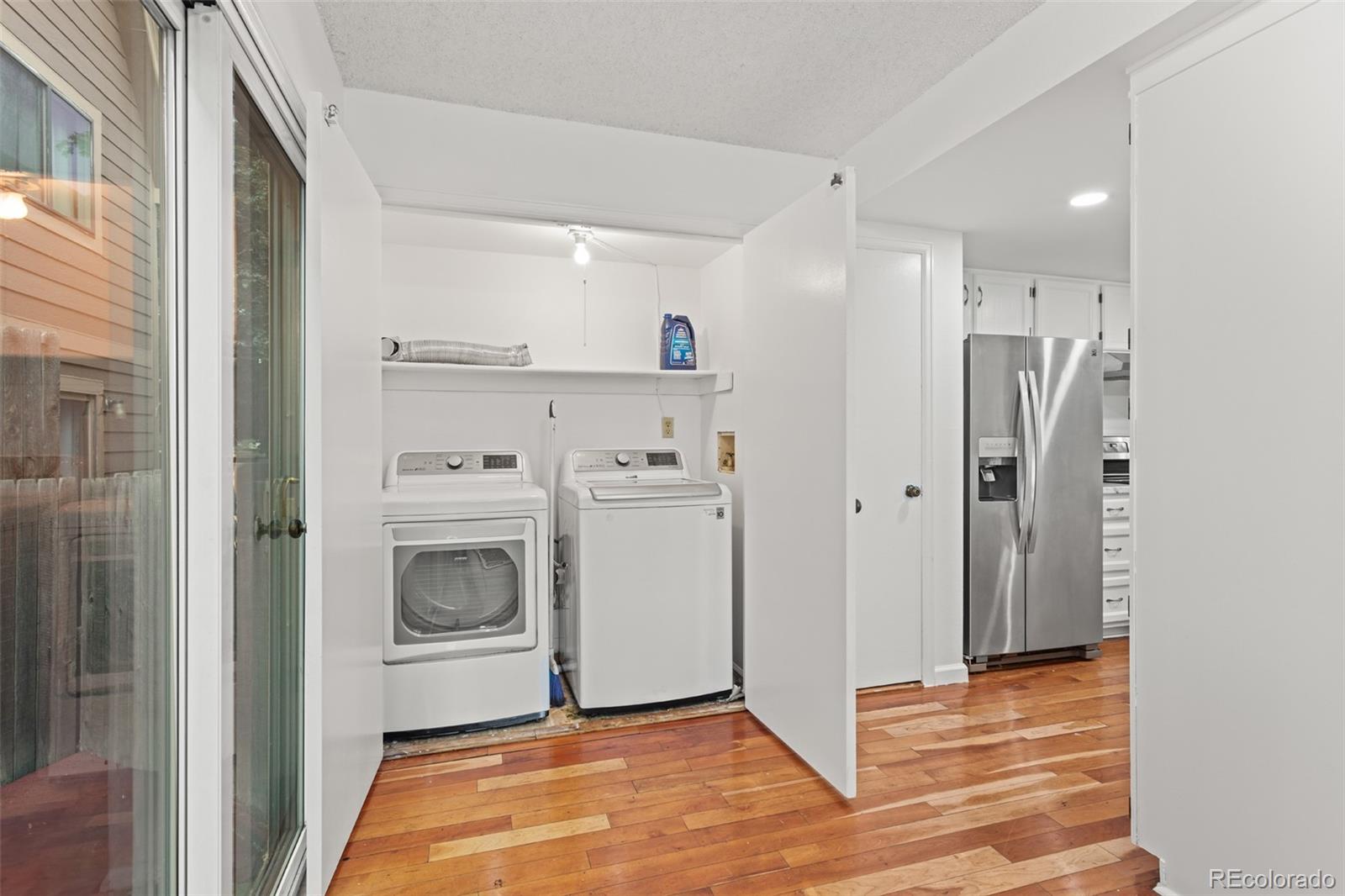 1720 South Quintero Way Aurora, CO 80017 - Photo 11 of 21 a view of a kitchen with a sink and a refrigerator