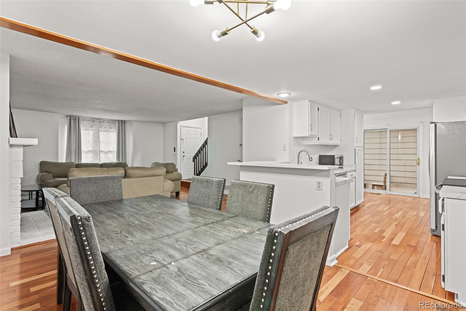 1720 South Quintero Way Aurora, CO 80017 - Photo 6 of 21 a living room with furniture and kitchen view