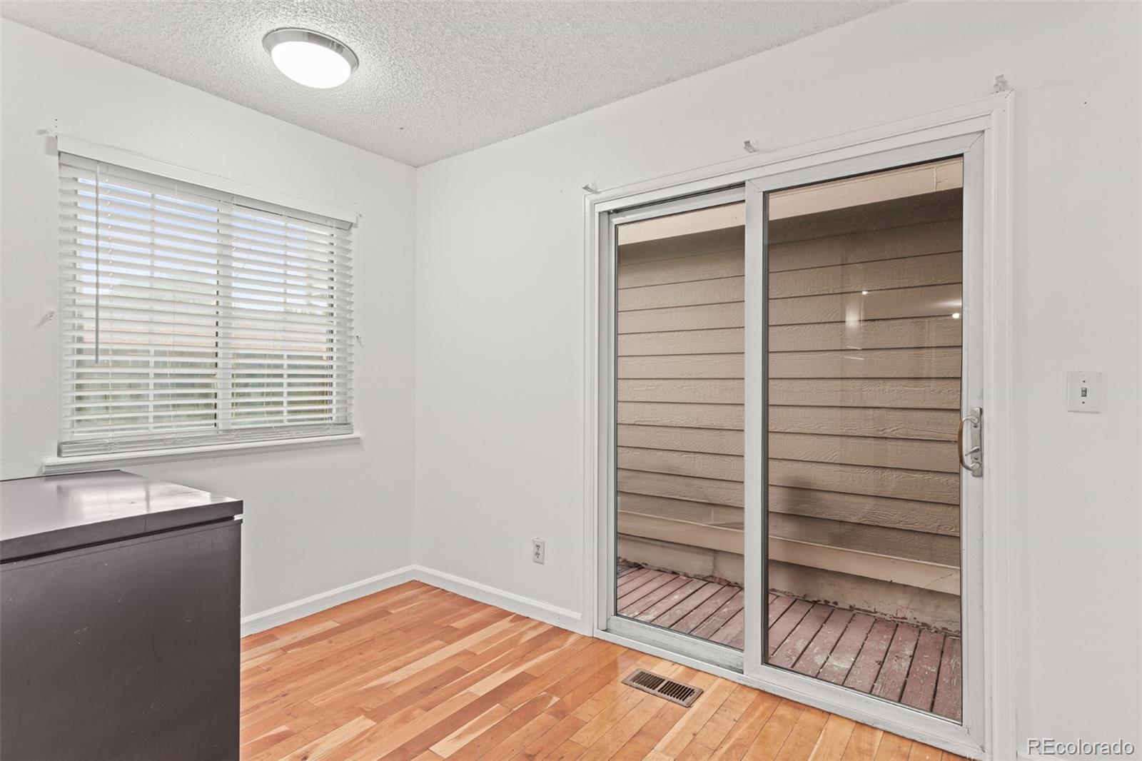 1720 South Quintero Way Aurora, CO 80017 - Photo 10 of 21 a view of walk in closet with empty racks