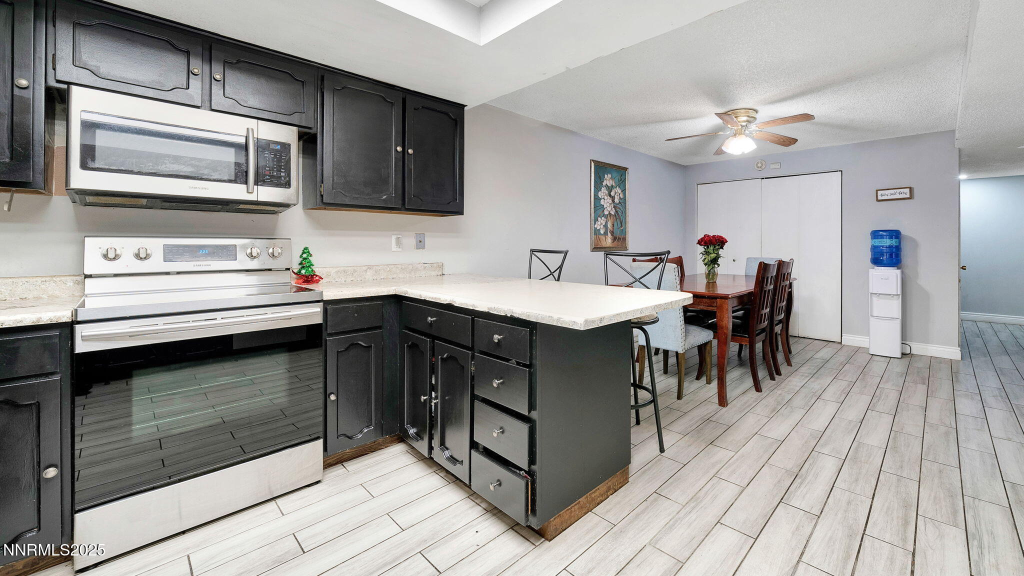 7640 Bluestone Drive Reno, NV 89511 - Photo 12 of 30 a kitchen with a sink appliances and cabinets