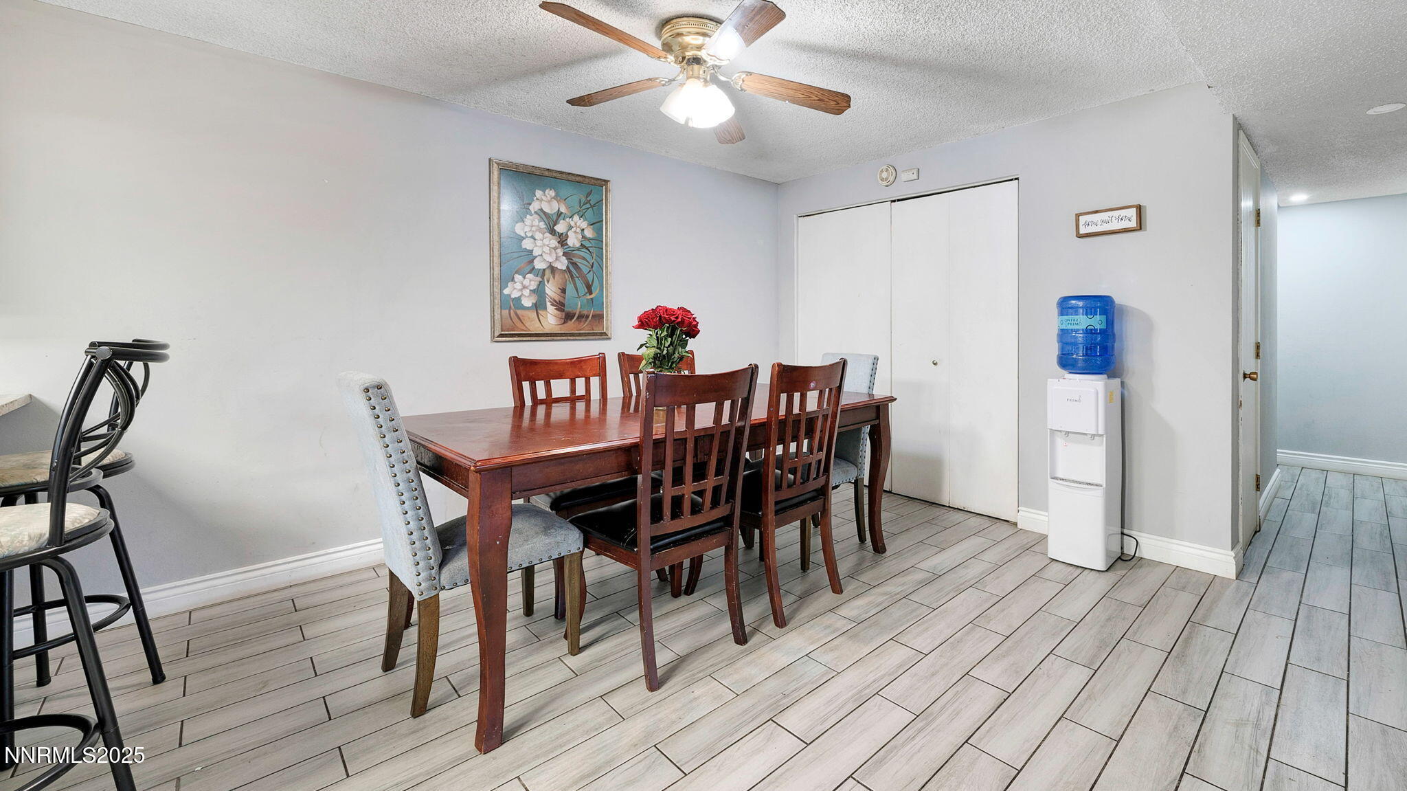 7640 Bluestone Drive Reno, NV 89511 - Photo 17 of 30 a view of a dining room with furniture and wooden floor