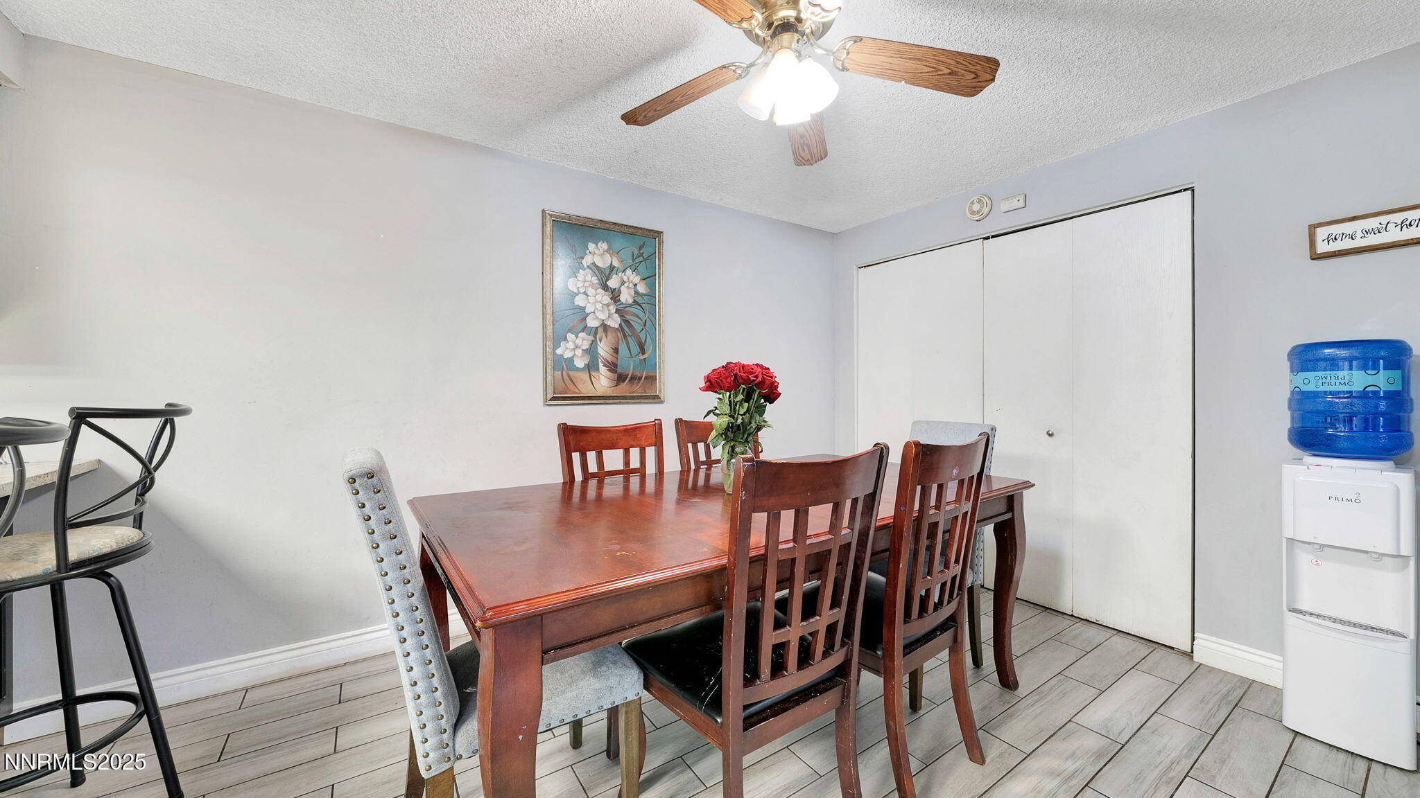 7640 Bluestone Drive Reno, NV 89511 - Photo 18 of 30 a view of a dining room with furniture and wooden floor