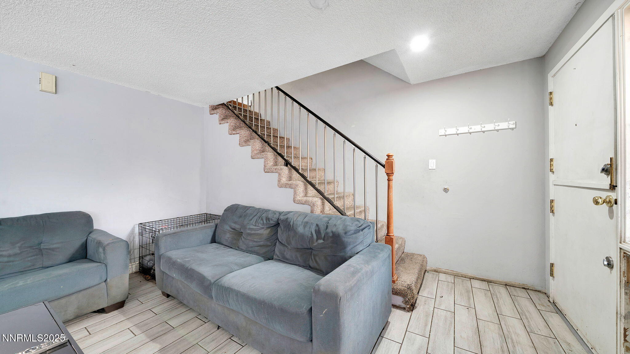 7640 Bluestone Drive Reno, NV 89511 - Photo 20 of 30 a living room with furniture and a wooden floor
