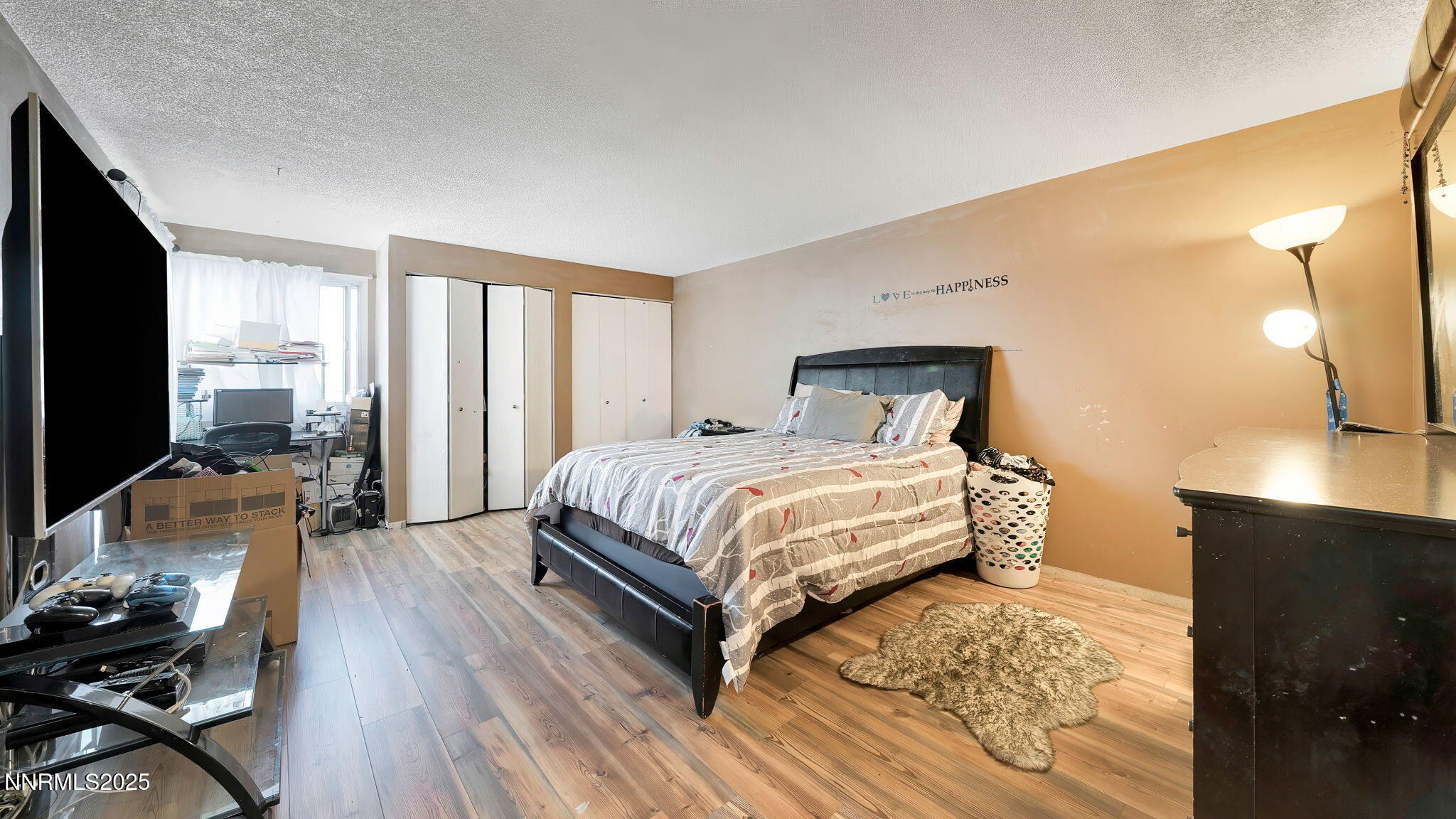 7640 Bluestone Drive Reno, NV 89511 - Photo 22 of 30 a bedroom with a bed and wooden floor