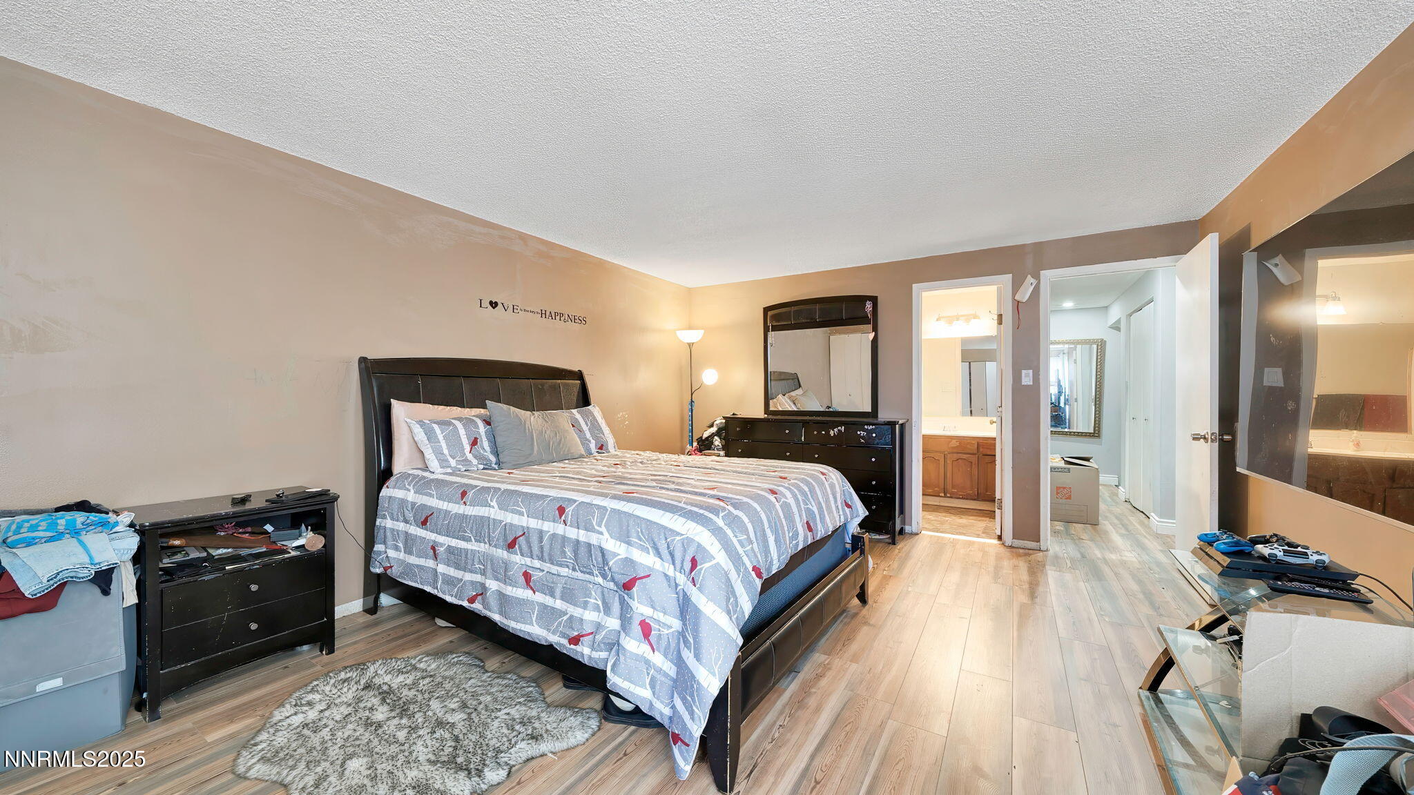 7640 Bluestone Drive Reno, NV 89511 - Photo 23 of 30 a bedroom with a bed and a mirror