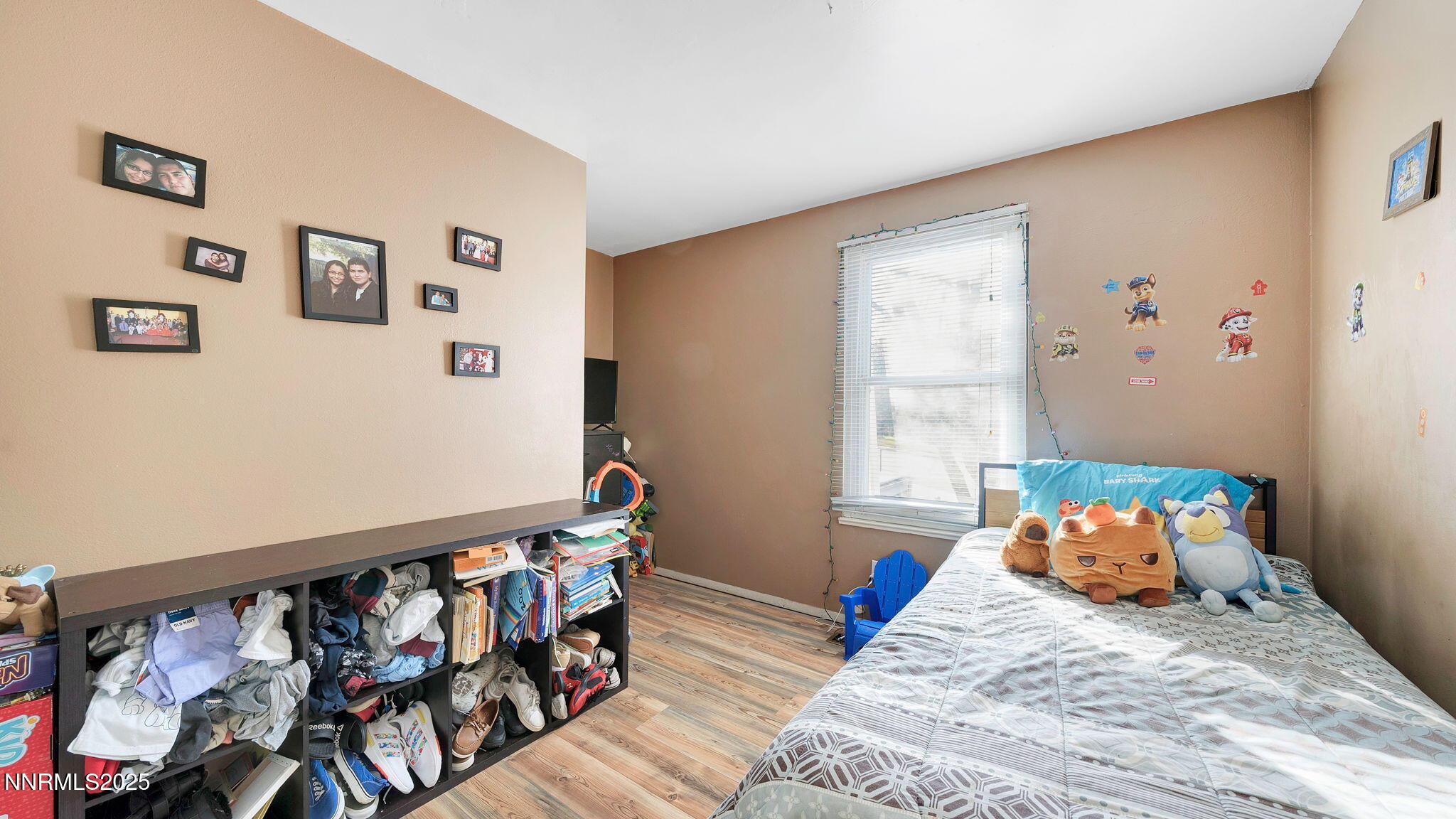 7640 Bluestone Drive Reno, NV 89511 - Photo 25 of 30 a bedroom with a bed and wooden floor