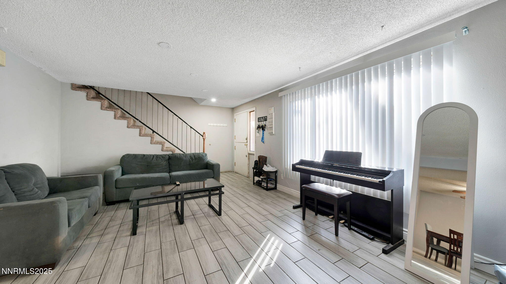 7640 Bluestone Drive Reno, NV 89511 - Photo 6 of 30 a living room with furniture and a wooden floor
