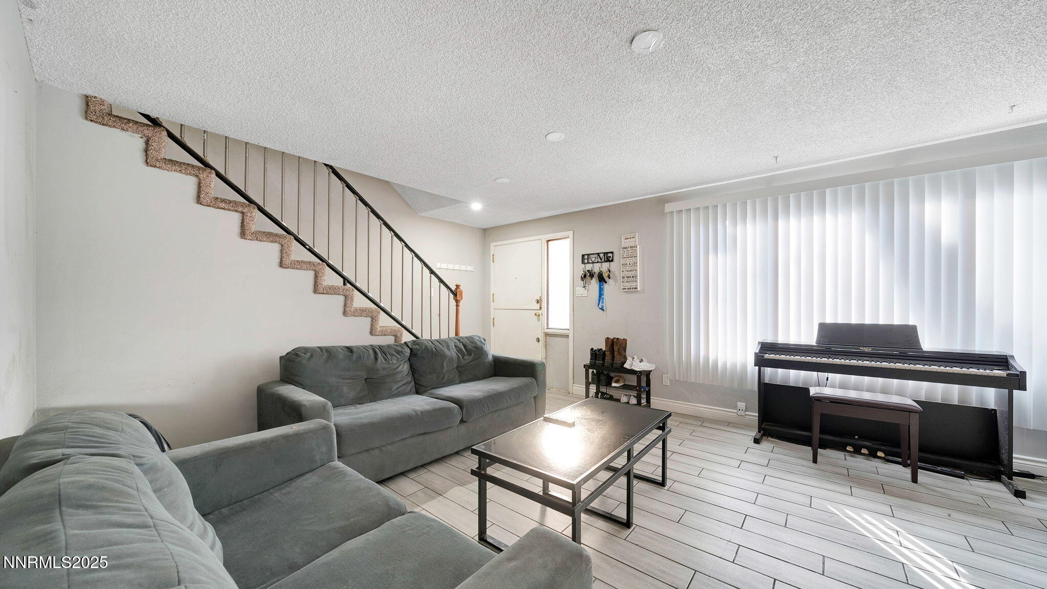 7640 Bluestone Drive Reno, NV 89511 - Photo 8 of 30 a living room with furniture and a wooden floor