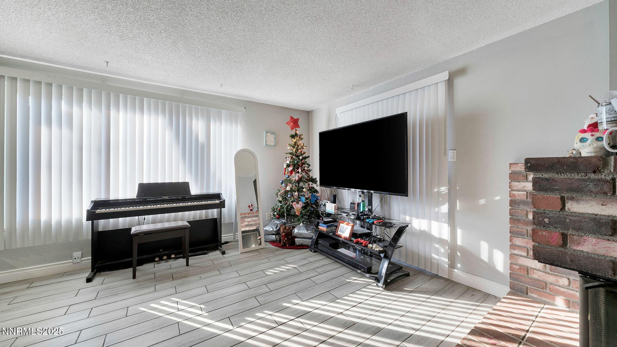 7640 Bluestone Drive Reno, NV 89511 - Photo 9 of 30 a living room with furniture and a flat screen tv