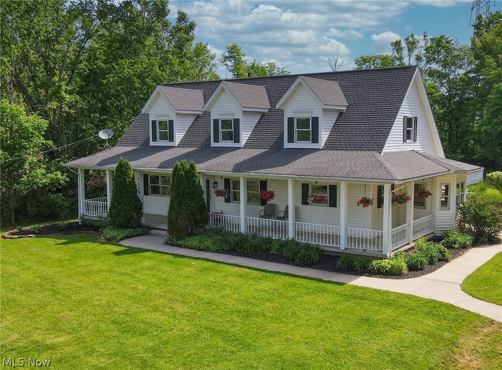 7609 Carter Road Northfield, OH 44067 - Photo 38 of 50 Wrap around porch adds to living space all summer long