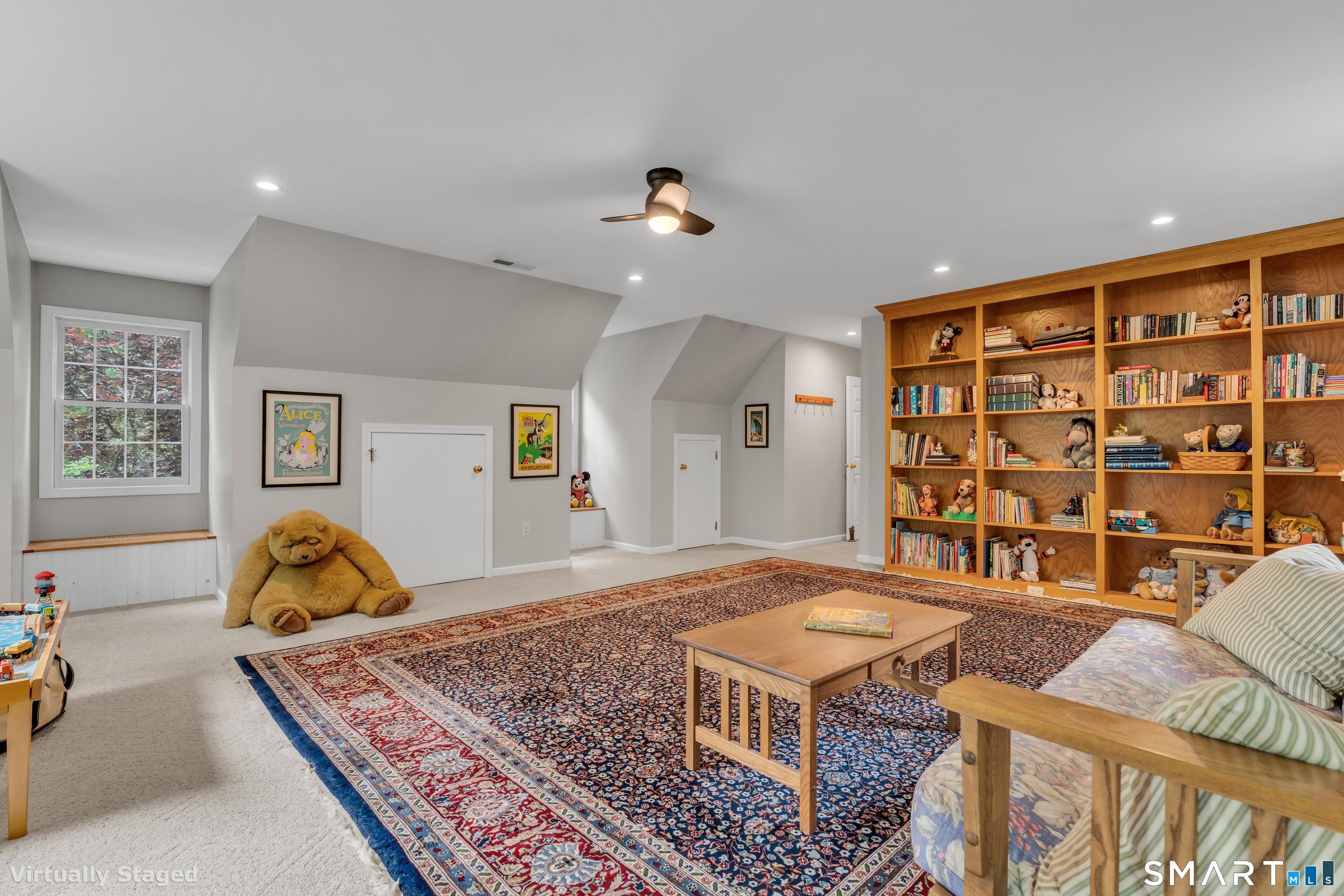 46 Laurel Cliffs Road Guilford, CT 06437 - Photo 24 of 40 The Bonus Room has built-in book shelves, eaves storage and window seats over toy boxes.