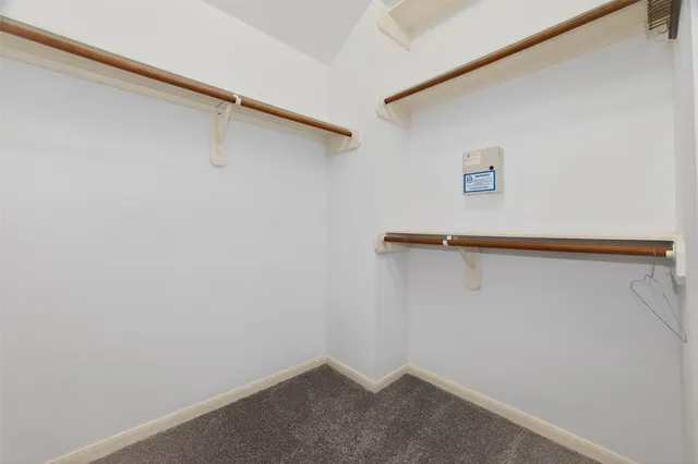 a view of a house with a wooden deck