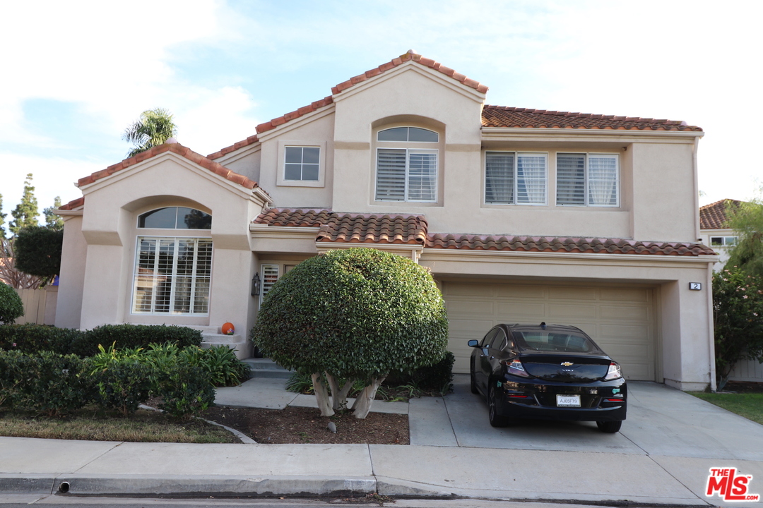 a car parked in front of a house