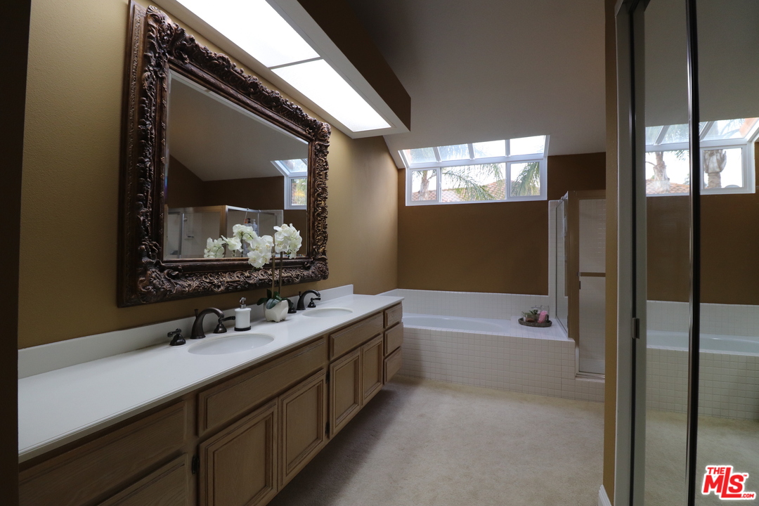2 Montage Irvine, CA 92614 - Photo 11 of 32 a bathroom with a bathtub double vanity sink and a mirror