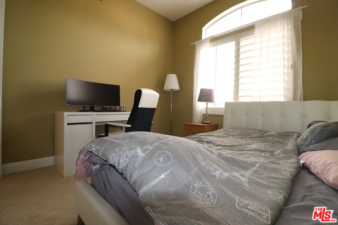 2 Montage Irvine, CA 92614 - Photo 17 of 32 a bedroom with a bed and a window