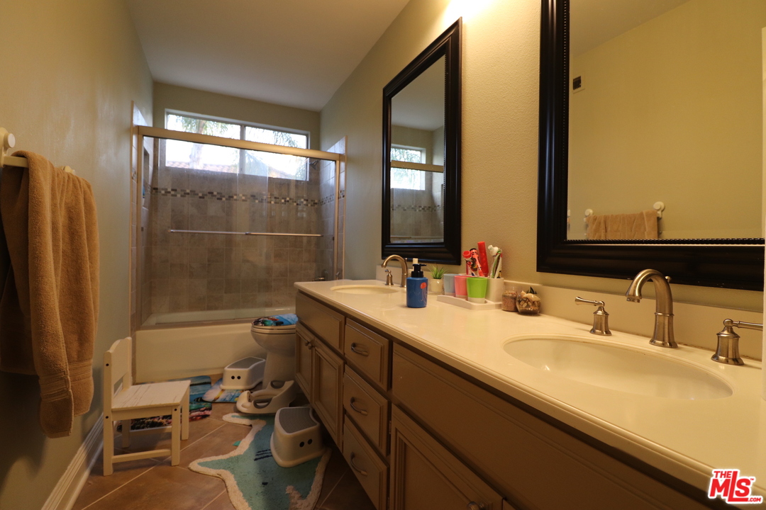 2 Montage Irvine, CA 92614 - Photo 18 of 32 a bathroom with a sink mirror vanity and toilet