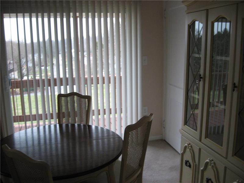 1005 Wible Run Road Pittsburgh, PA 15209 - Photo 7 of 15 Dining area with walk out to deck and entry to walk up attic.